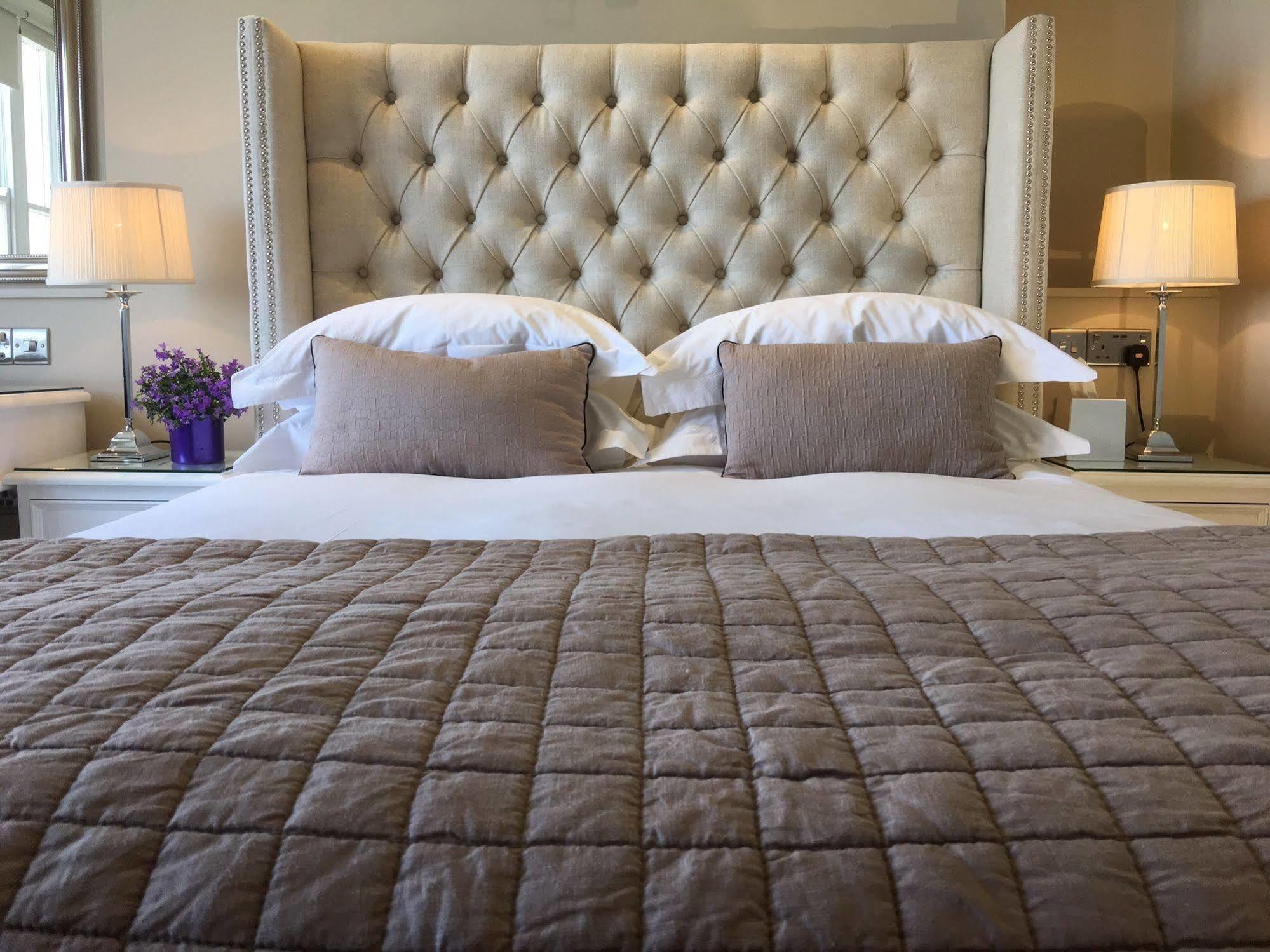 A Room With A View Brighton Exterior photo A bed with a tufted headboard